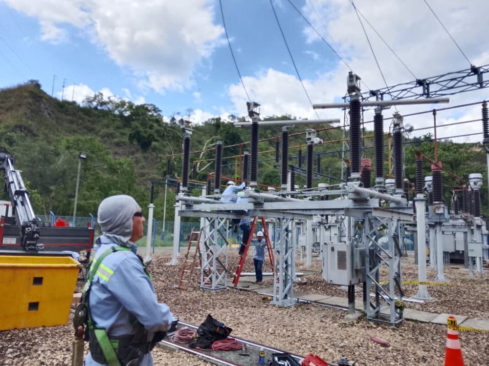 ADT personnel during the installation of the 115 kV disconnector