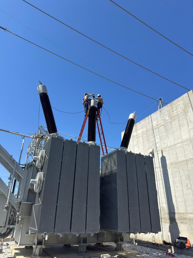ADT personnel during the commissioning of the 230 kV transformer